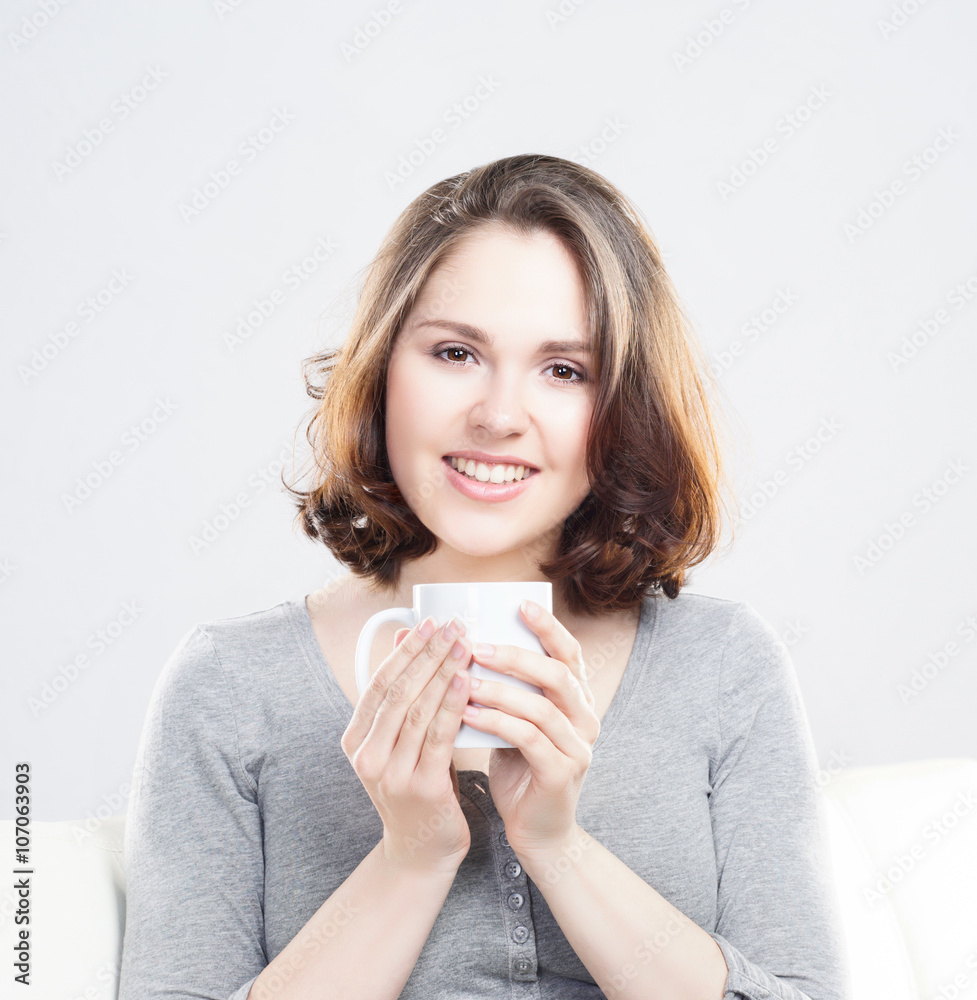 Attractive girl enjoying a cup of coffee at home Attractive girl enjoying a cup of coffee at home