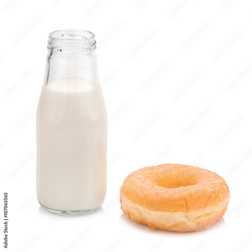 Milk bottle and donut on white background Milk bottle and donut on white background