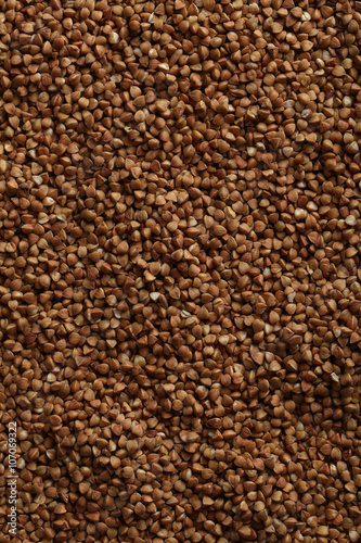 Pile of buckwheat seeds background  close up