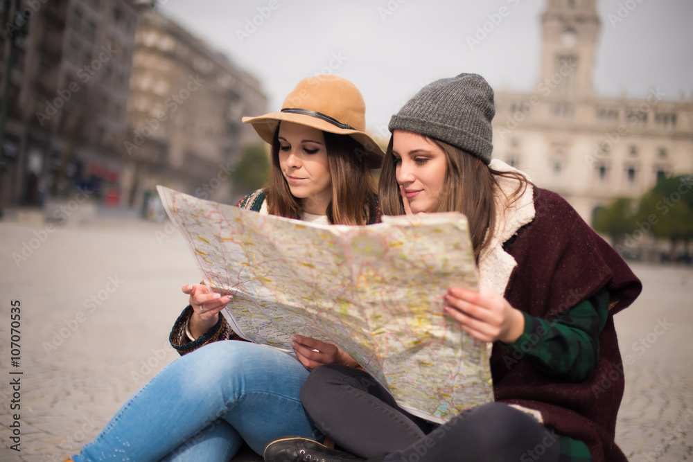 Friends consulting a city map