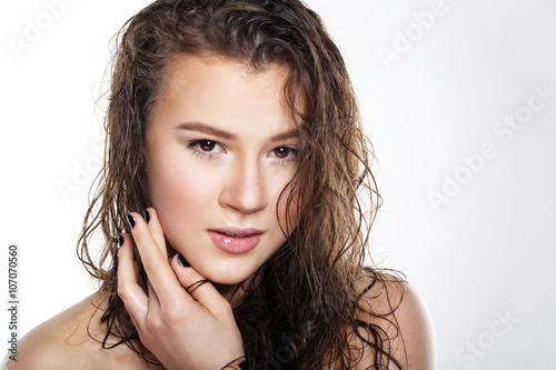 beautiful girl with wet hair on a white background