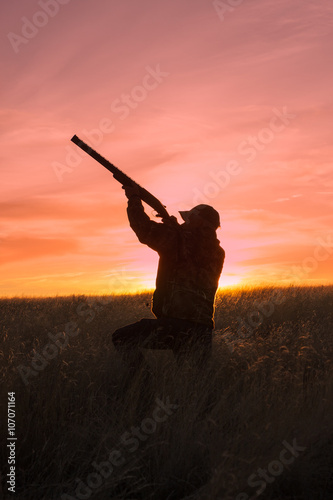 Hunter Shooting at Sunrise