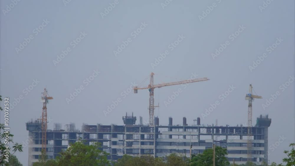 4k Time-lapse of Building construction with Crane at construction site