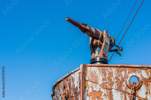 Close-up of harpoon gun on rusty bow