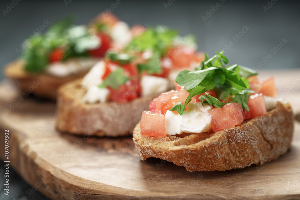 homemade bruschetta with cheese and vegetables, shallow focus homemade bruschetta with cheese and vegetables, shallow focus