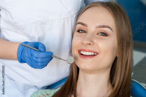 Dentist examining a patient s teeth