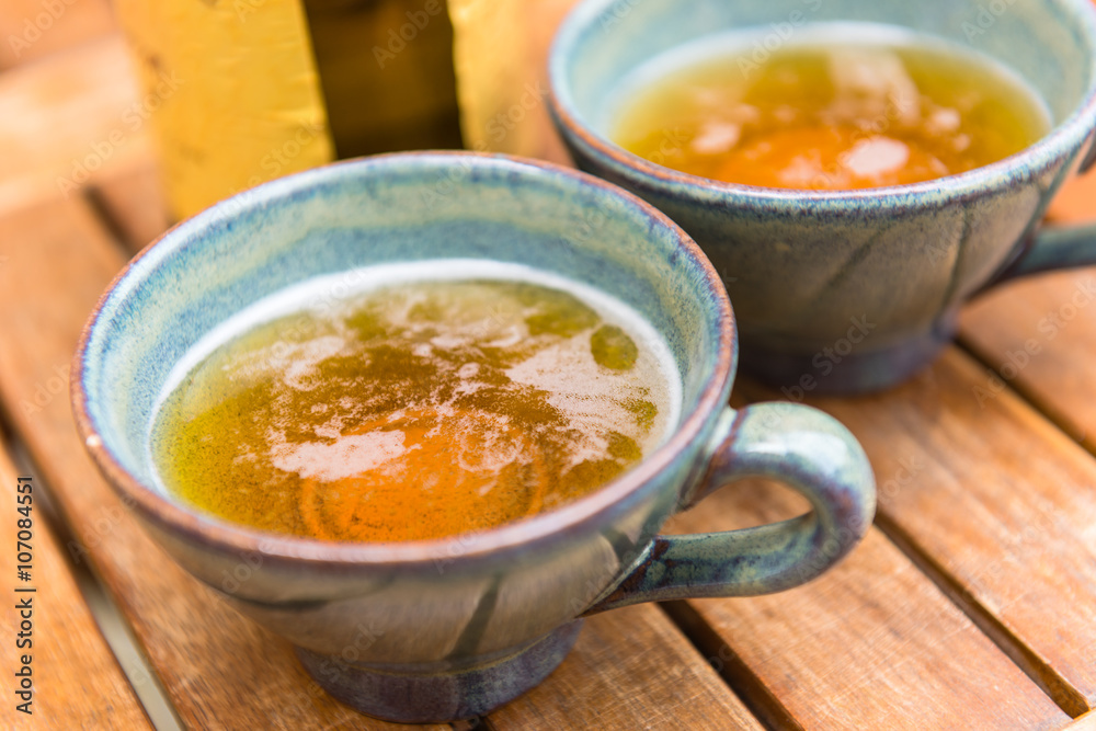 Norman apple cider in a typical ceramic cups Norman apple cider in a typical ceramic cups