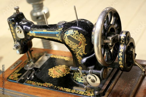 Black retro sewing machine in an old house