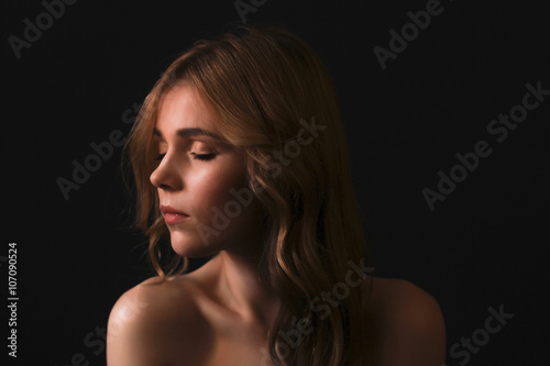 Sensual blonde woman with closed eyes