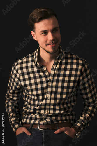Young man studio portrait with shadows