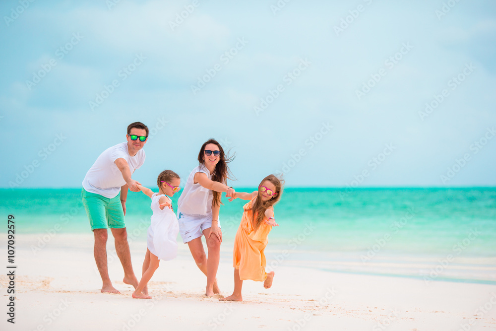 Happy young family on beach vacation
