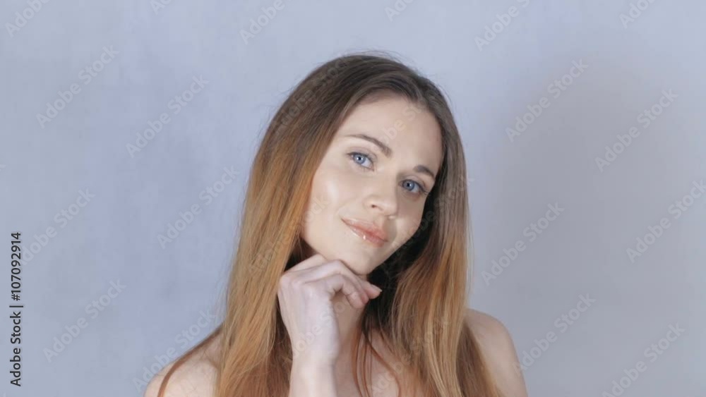 Portrait of beautiful blonde woman over grey background. Young beautiful woman with perfect skin and face over grey background. Portrait of beautiful blonde woman over grey background. Young beautiful woman with perfect skin and face over grey background.