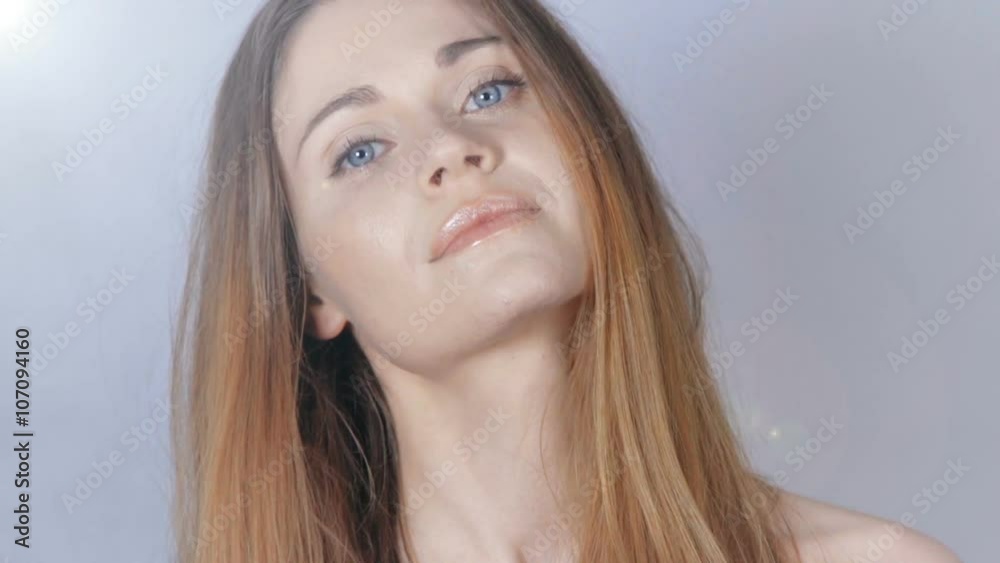 Portrait of beautiful blonde woman over grey background. Young beautiful woman with perfect skin and face over grey background. Portrait of beautiful blonde woman over grey background. Young beautiful woman with perfect skin and face over grey background.