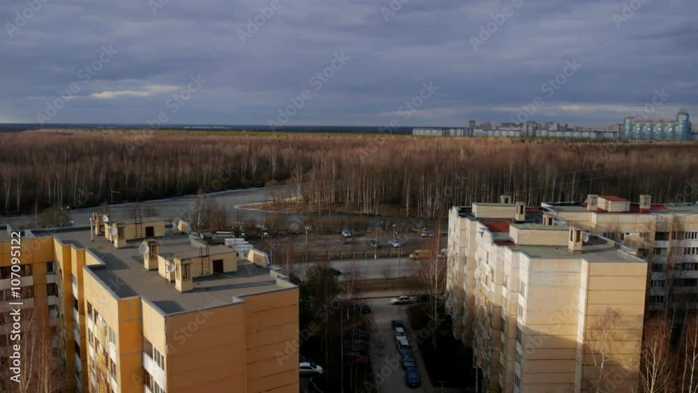 place where city ends and nature begins. spring view with houses, forest and clouds shadows place where city ends and nature begins. spring view with houses, forest and clouds shadows