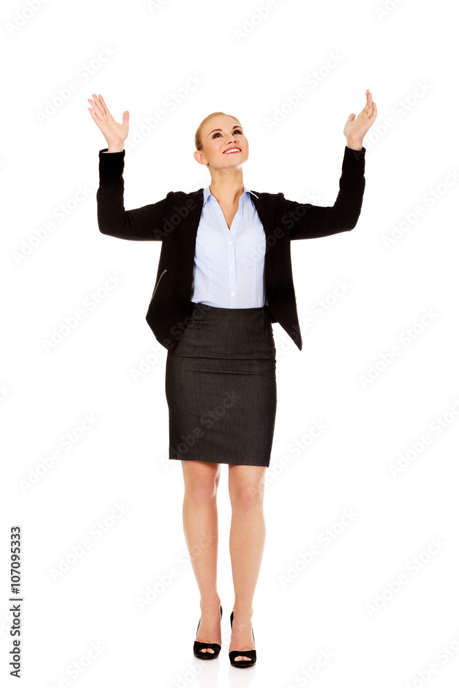 Young businesswoman trying to catch something Young businesswoman trying to catch something