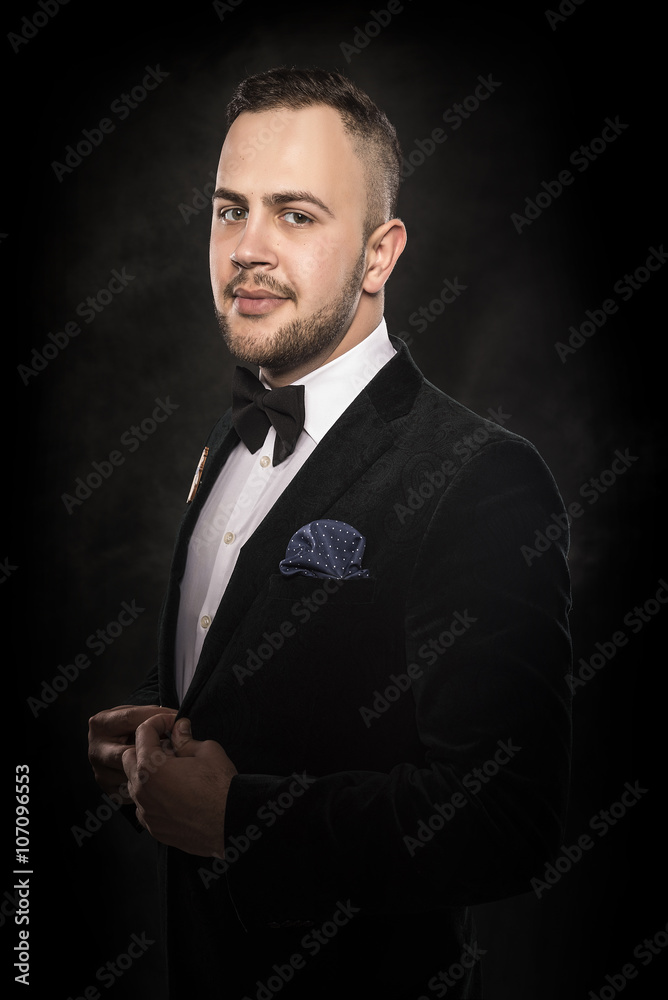 Young handsome man in black suit. Young handsome man in black suit.