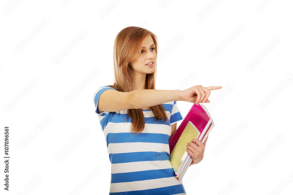 Teenage woman showing copyspace or something Teenage woman showing copyspace or something