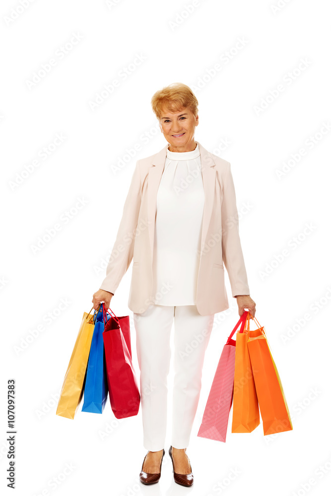 Happy business woman holging shopping bags Happy business woman holging shopping bags
