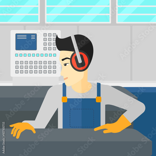 Man working on steel-rolling mill.