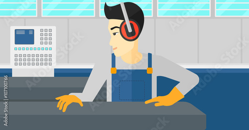 Man working on steel-rolling mill.
