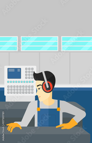 Man working on steel-rolling mill.