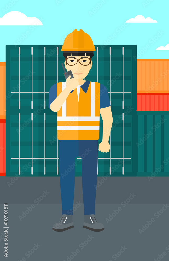 Stevedore standing on cargo containers background. Stevedore standing on cargo containers background.