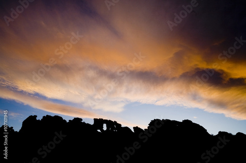 The sun sets behind The Keystone, a natural rock arch at Devil's Backbone Open Space in Loveland, Colorado.
