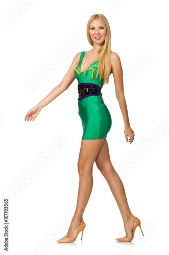 Tall model in mini green dress isolated on white