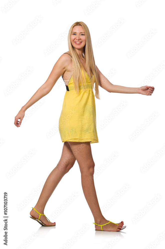 Caucasian fair model in yellow summer dress isolated on white Caucasian fair model in yellow summer dress isolated on white