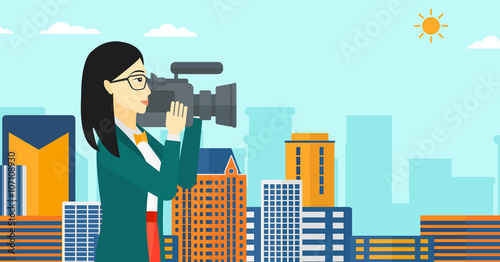 Camerawoman with video camera.