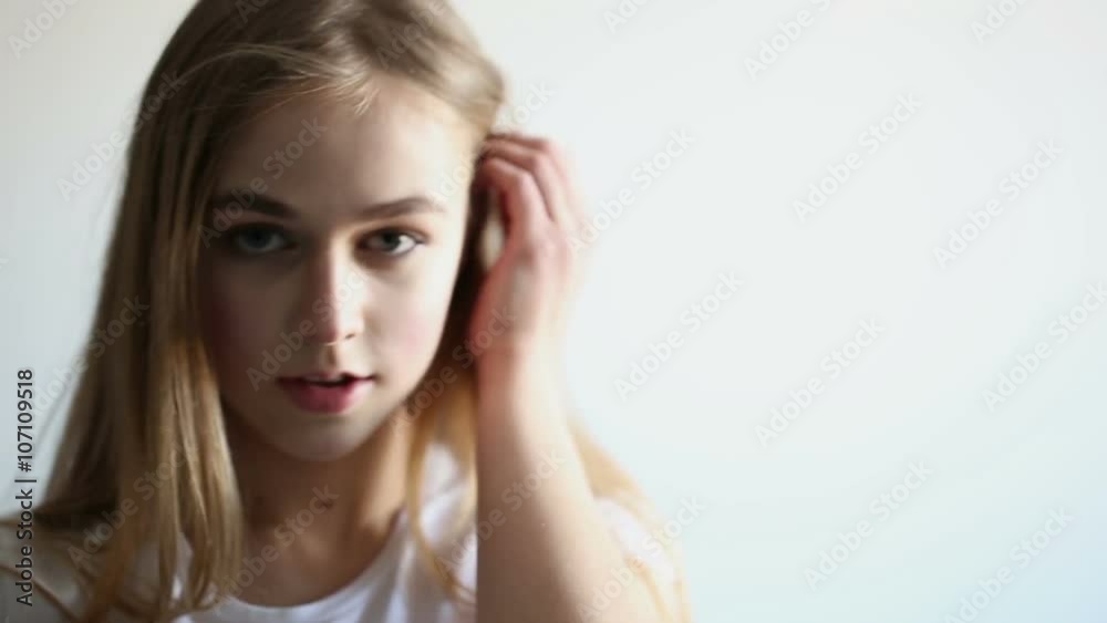 beautiful young girl posing in the studio on a white background beautiful young girl posing in the studio on a white background