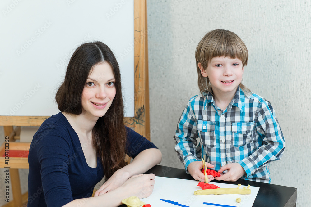 child kid boy and mother play colorful clay child kid boy and mother play colorful clay