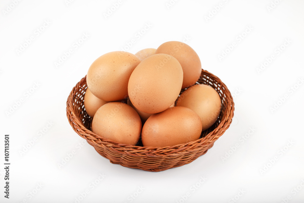whole brown eggs in a wicker basket whole brown eggs in a wicker basket