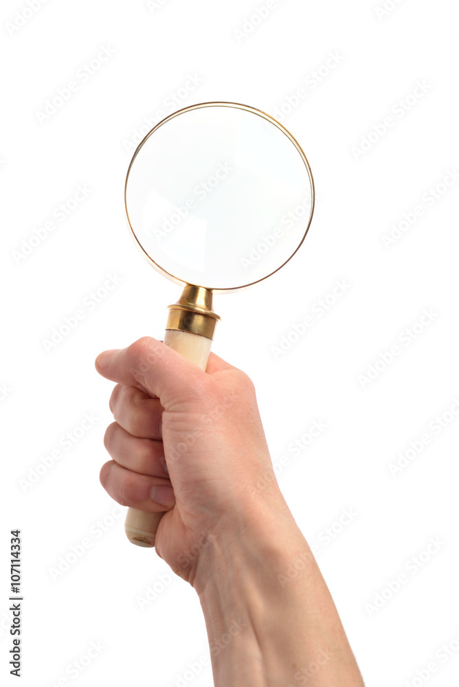 Hand mit einer Lupe auf weißem Hintergrund Hand mit einer Lupe auf weißem Hintergrund