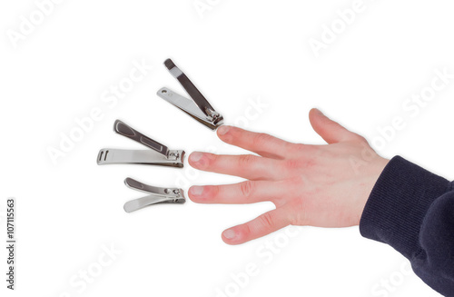 Three nail clippers opposite the fingers of a male hand