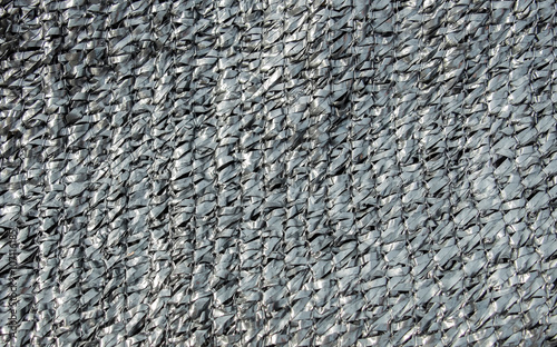 Abstract Shiny Black Weave Plastic Pattern used as Background Texture