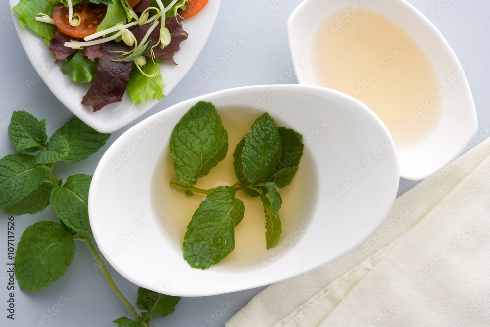 Vinaigrette dressing with mint leaves. Vinaigrette dressing with mint leaves.