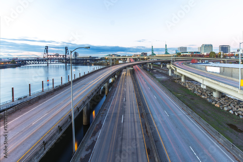 traffic on road with cityscape and skyline of portland