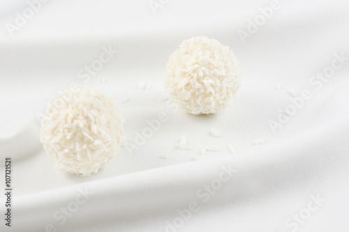 White chocolate candy coconut truffles on white material