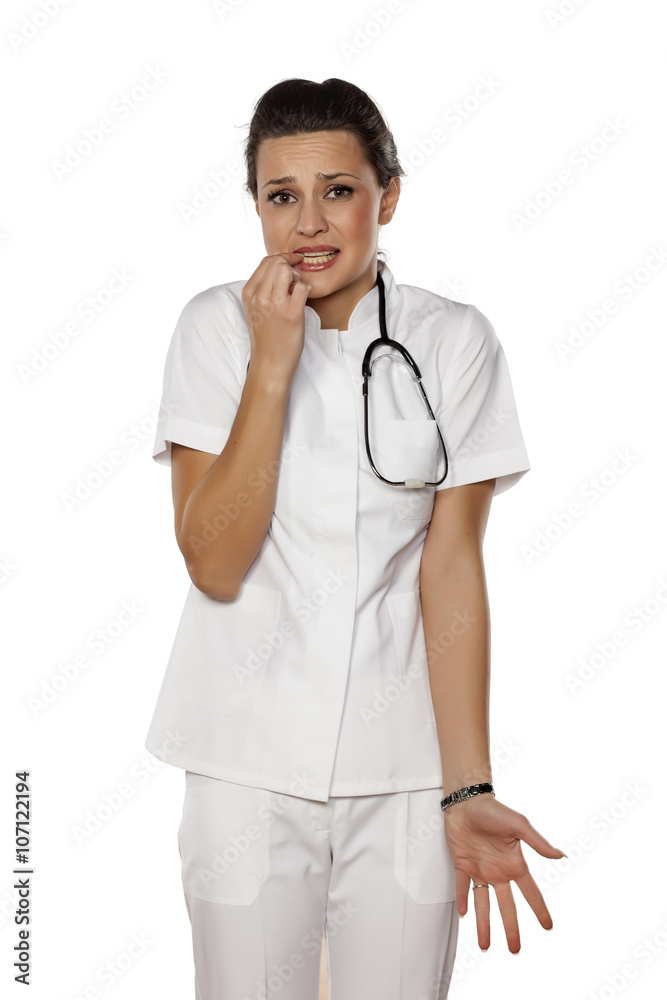 a young woman doctor with a mistake gesture a young woman doctor with a mistake gesture