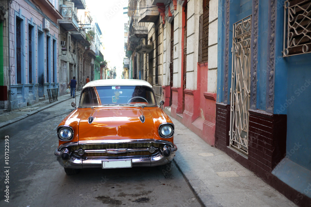 Beautiful old american car in deserted Havana street