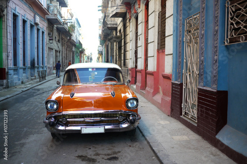 Beautiful old american car in deserted Havana street