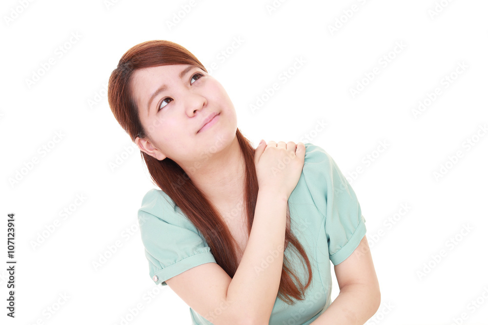 肩こりを訴える女性 肩こりを訴える女性