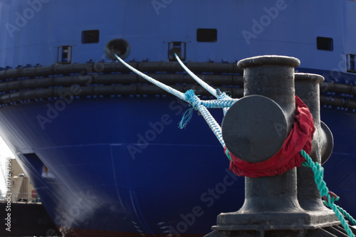 rope anchoring the ship backgriund. mooring end