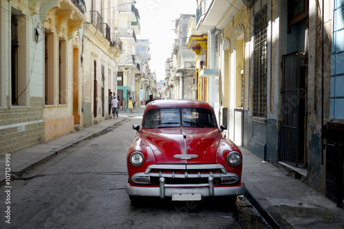 street scene in havana  cuba with old car