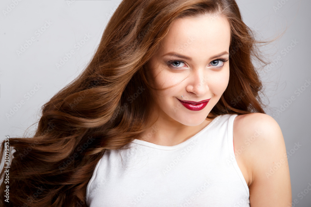 Close-up portrait of beautiful young woman with gorgeous hair and natural makeup. Fashion beauty photo Close-up portrait of beautiful young woman with gorgeous hair and natural makeup. Fashion beauty photo