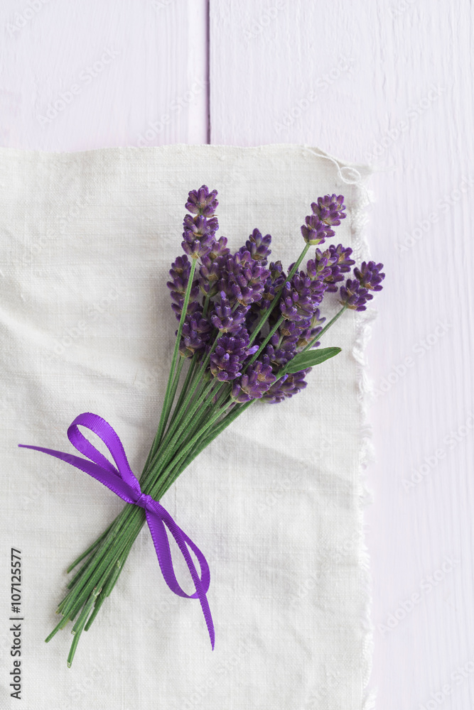 nice bundle of lavender on pink wooden table