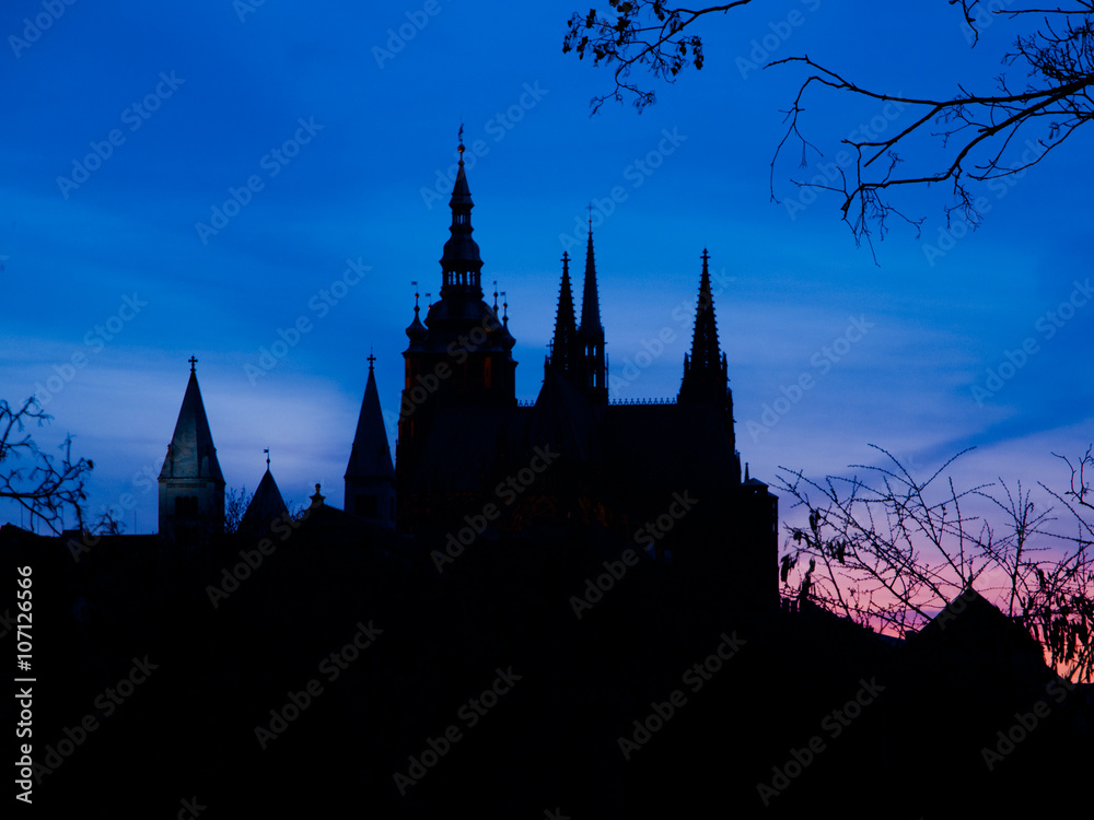 Prague Castle towers silhouette at sunset time