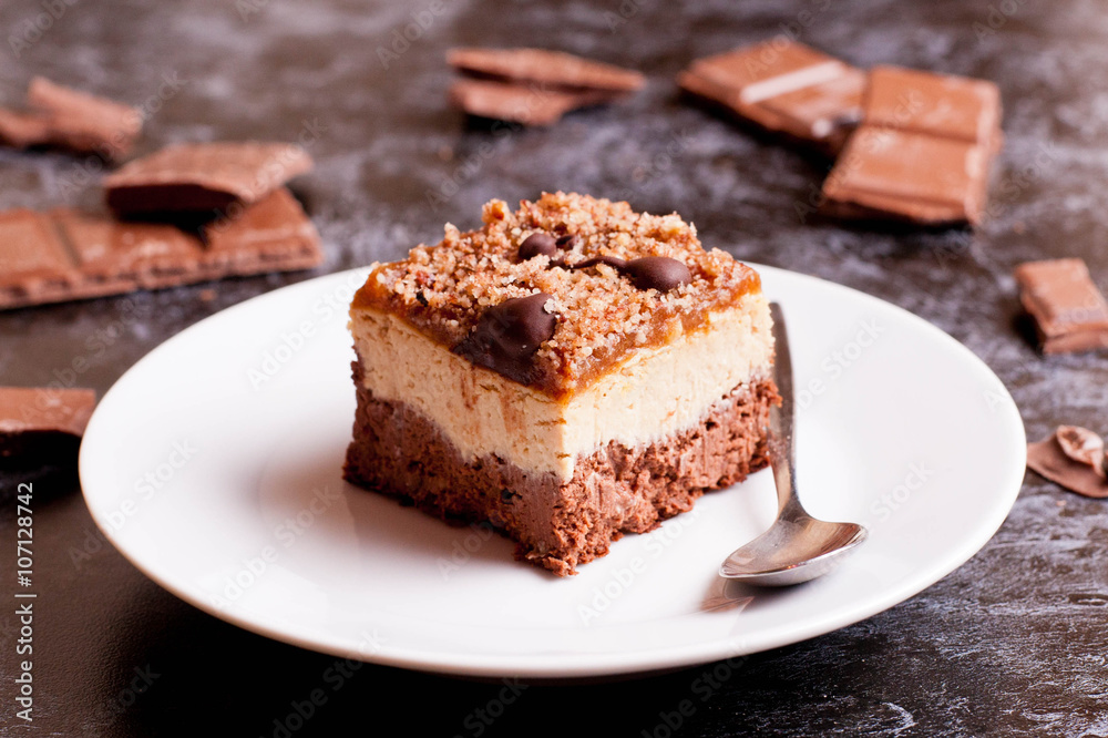 Close up plate of brownies with nuts and caramel sauce Close up plate of brownies with nuts and caramel sauce