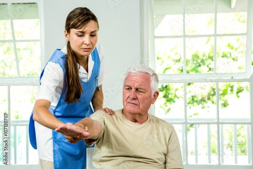 Senior man being examined by nurse